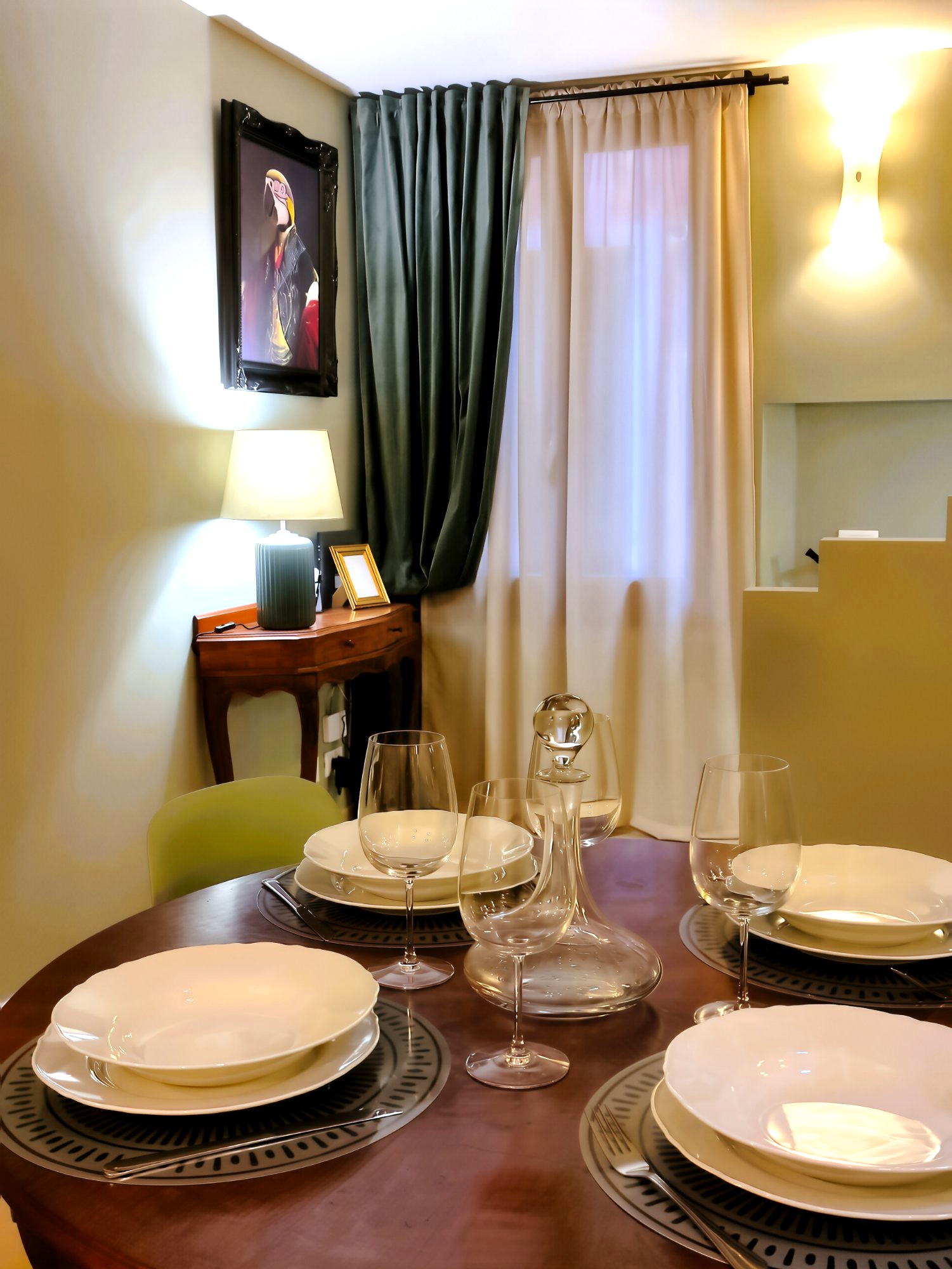 La Serenissima dining area with antique table and wine glasses